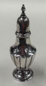 A small silver pepper caster with half fluted body. Birmingham 1901. Approx. 28 grams. Est. £20 - £