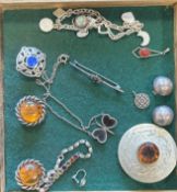 A silver charm bracelet etc.
