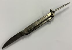 A novelty silver combination travelling knife. Lon