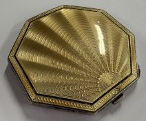 A silver and yellow enamelled compact. Birmingham