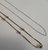 A 9 carat fancy link chain together with one other.