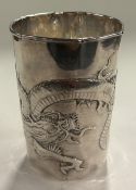 A 19th Century silver beaker with embossed decorat