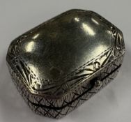 A Sterling silver pill box with engraved cross dec