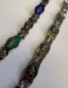 A silver niello bracelet together with one other.