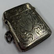 An early 20th Century silver vesta case with engra