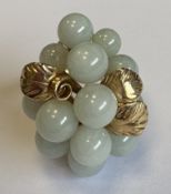 An unusual 14 carat gold hardstone ring.