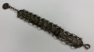 A silver bracelet decorated with Zodiac signs. App