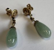 A pair of 18 carat gold-mounted hardstone earrings.