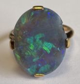 A single-stone opal ring in 9 carat claw mount.