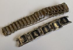 Two Continental silver and niello bracelets with concealed clasps.