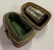 A novelty Victorian silver castle top thimble cont