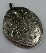 A silver locket with bright-cut decoration. Birmin