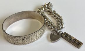 A heavy silver curb link bracelet together with a bangle etc.
