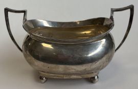 A boat-shaped Georgian silver sugar bowl on ball f