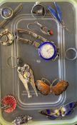 An enamelled wristwatch, brooches etc.