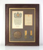 A framed pair of First World War medals including British War and Victory, awarded to 7686 Pte. J.