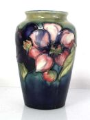A Moorcroft vase of baluster form decorated in the anemone pattern, h. 16 cm Heavy crazing, glaze
