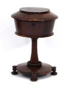 A William IV mahogany circular work table, the lid opening to reveal a lined interior, on a
