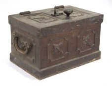 A cast iron strong box relief decorated with floral sprays, lock and handle to the top, carrying