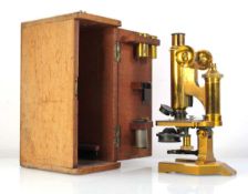 A brass microscope by R&J Beck Ltd., numbered 25963, cased, overall h. 28 cm