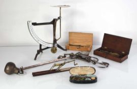 A set of 19th century cast metal, brass and enamelled scales, together with a Georgian folding