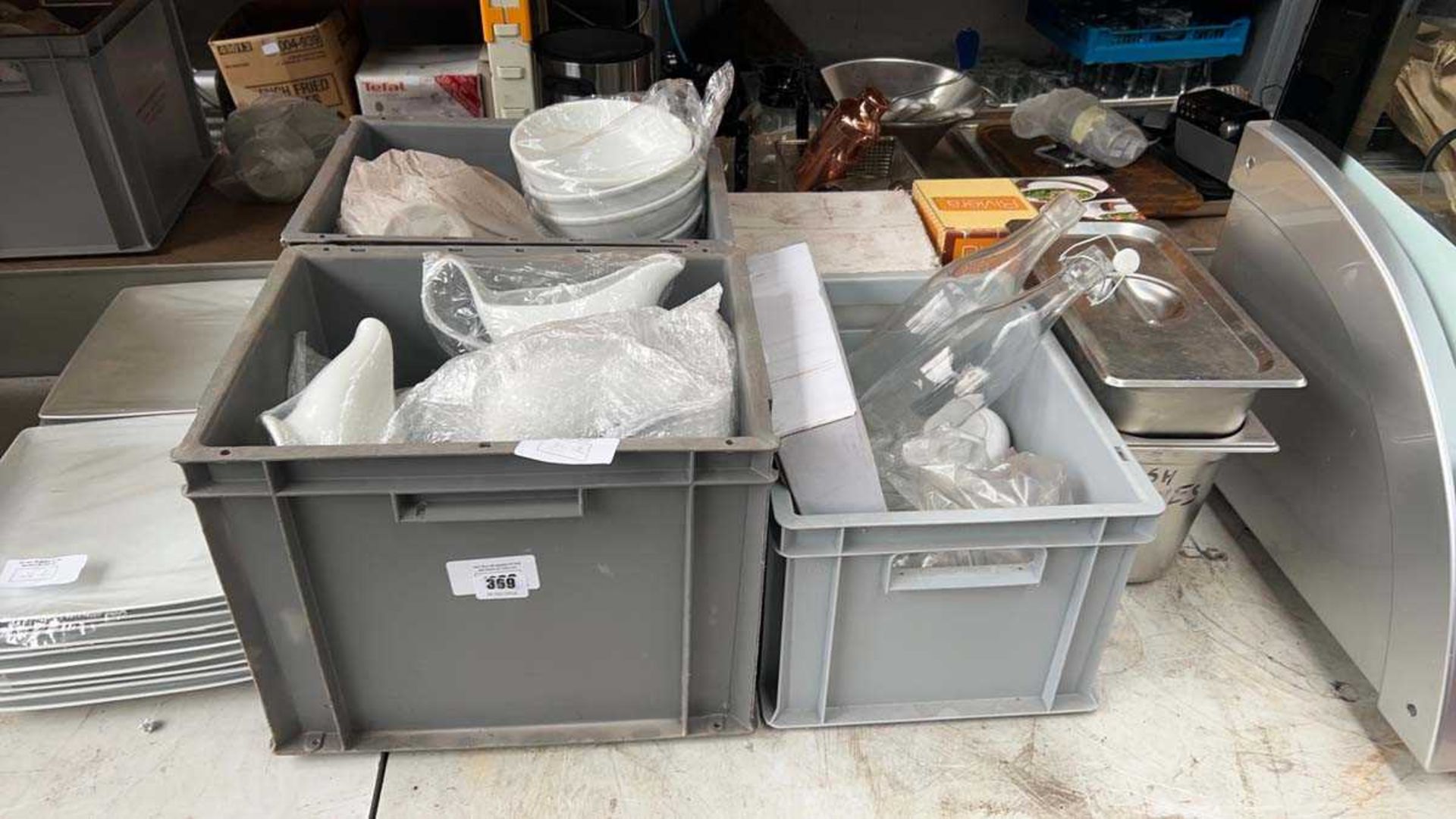 +VAT Table top of assorted white crockery to include square plates, serving dishes, gravy boats,