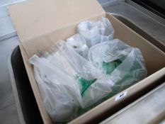 Box containing various green coloured drinkware