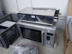 Small stainless steel coffee knock out drawer and a domestic microwave oven (failed electric