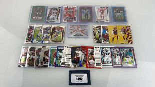 +VAT Quantity of Top Loaded/Sleeved NFL trading cards Where possible these cards have been