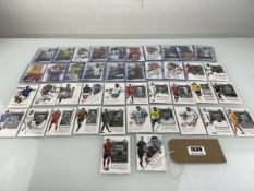 Approx. 18 Top Loaded Futera Football trading cards plus 24 Futera Unique loose trading cards