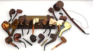 A group of pipes including a cased meerschaum style example, figural examples etc. together with a