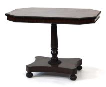 A 19th century mahogany tilt-top table, the beadwork surface on a turned pillar, platform base and