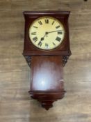 A 19th century tavern-style wall clock, the 13 inch dial with Roman numerals, within a mahogany
