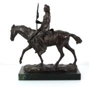 A bronze sculpture modelled as a Native American seated on horseback, initialled RC, on a marble