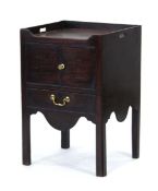 A George III mahogany pot cupboard or washstand, the galleried surface over two doors and a pull-out
