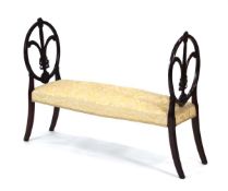 A 19th century window seat, the mahogany ends presumably converted from dining chairs, with an
