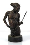 A bronzed figure of a Native American wearing traditional dress, h. 31 cm