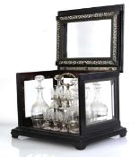 A 19th century 'Cave à Liqueur' liquor cabinet, the ebonised body with five-glass panels and ivory