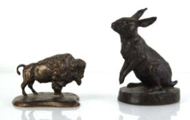 A bronze figure modelled as a hare, signed Donaldson and dated '88, h. 12 cm, together with a cast