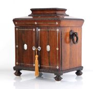 An early 19th century rosewood and mother-of-pearl inlaid ladies compendium table-top cabinet, the