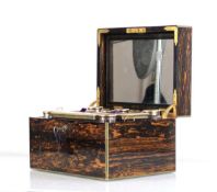 A Victorian coromandel and brass bound travelling vanity box by C Betjemann & Sons, the fitted