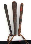 A 19th century polychrome turned police truncheon, 39 cm, together with two further truncheons (3)