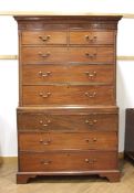 A George III mahogany chest-on-chest with an arrangement of two short over three long drawers, a
