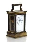 A 20th century French carriage timepiece, the white enamelled face with Roman and Arabic numerals