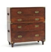 A Victorian two-part campaign chest with brass mounts, flush handles and carry handles to the sides,