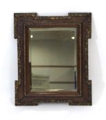 A Victorian oak and gilt highlighted wall mirror of castellated form inset with a bevelled plate, 58
