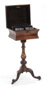 A mid-19th century rosewood teapoy, the lid opening to reveal two detachable cannisters and two