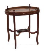 A Sheraton Revival satinwood and marquetry oval galleried table, the surface with swag carvings,