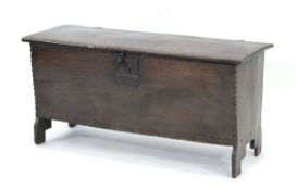 A late 17th/early 18th century oak six-plank coffer or hutch with chamfered edges, the interior with