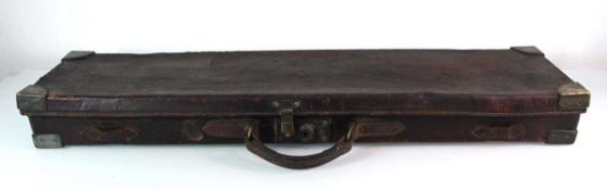 A leather and brass mounted gun case with impressed marks 'B.A.G., R. Berks Regt.' to the surface,